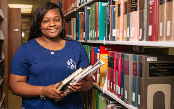 Student with Textbooks