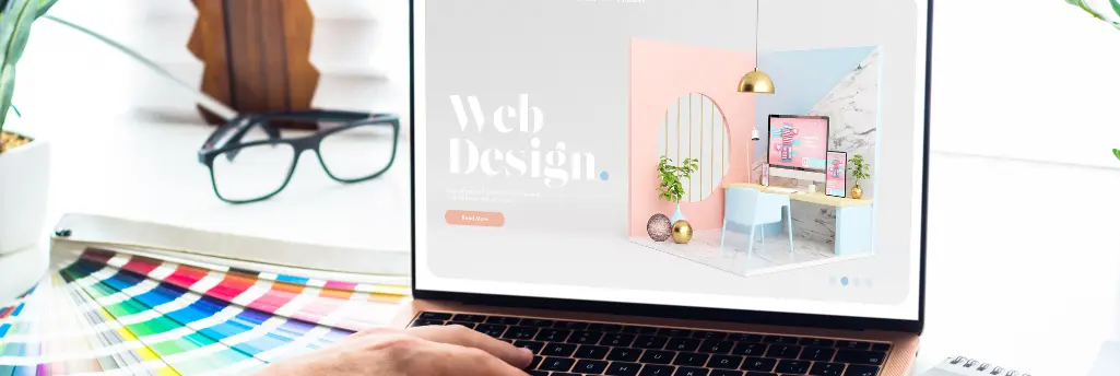 A modern web design concept displayed on a laptop screen, featuring a stylish interior with colorful walls and a creative workspace.